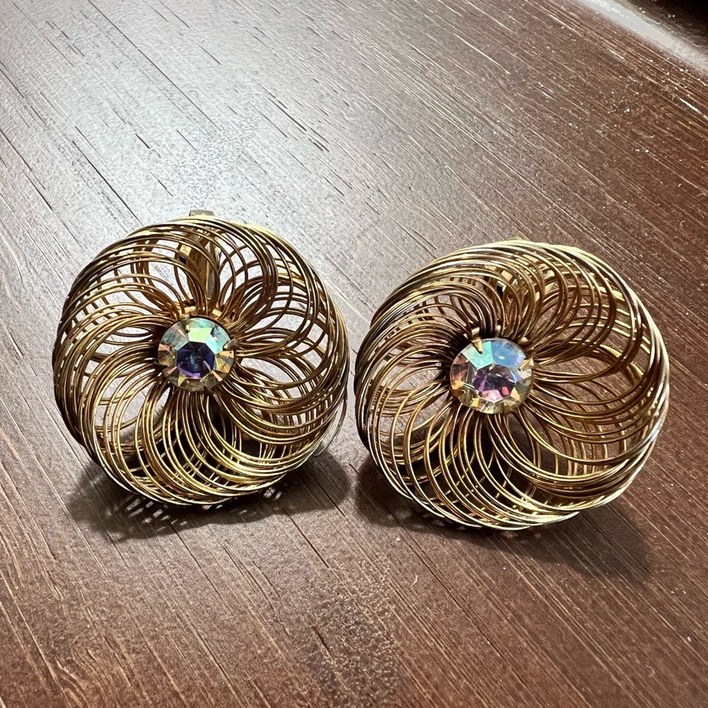 Vintage SAC gold tone spun wire with AB rhinestone center paddle back earrings.